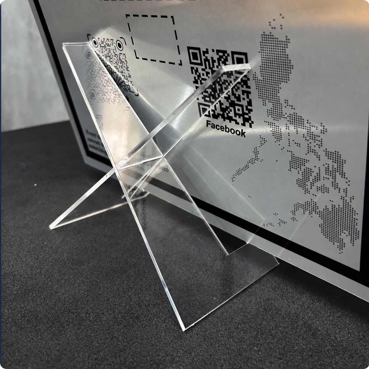 Clear acrylic frame stand supporting a Metalix print