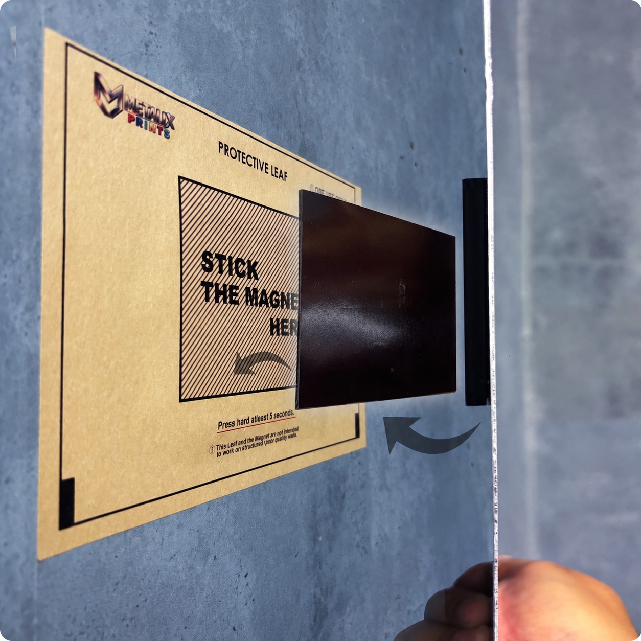 Metalix wall-protection sticker with the magnetic mount being applied